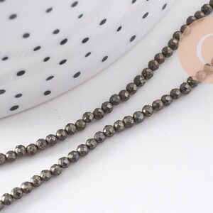 Perles rondes pyrite naturelle facettée 2mm, x1 fil de 40cm (G4046)