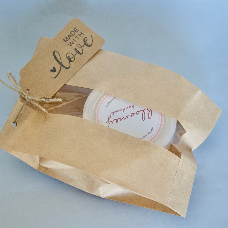 Raspberry & Pomegranate Body Butter packaged in a kraft bag & a kraft tag with the "Made With Love" Message On It