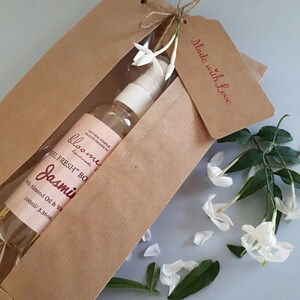 Jasmine Moisturizing Body Oil beautifully packaged in a kraft paper bag with a "Made with love" stamped  Kraft Tag on it