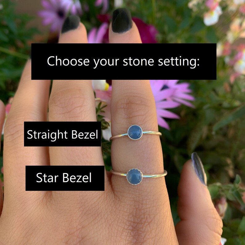 May include: Two silver rings with blue stones. The top ring has a straight bezel setting, while the bottom ring has a star bezel setting. The text "Choose your stone setting:" is above the rings. The text "Straight Bezel" is to the left of the top ring, and the text "Star Bezel" is to the left of the bottom ring.