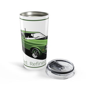 May include: White travel mug with a green and black illustration of a classic green car. The mug has a silver rim and a matching lid. The words "ed. Refined" are printed on the mug.