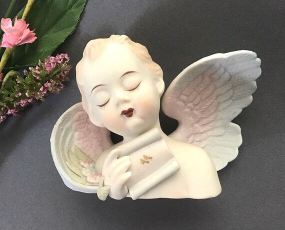 ヴィンテージ ラムール チャイナ 天使像：1940年代の天使像、占領下の
