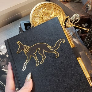 Adesivo Anubis - lamina d'oro cromata metallizzata - fustellato - mitologia egizia - cane nero segugio sciacallo - lucido