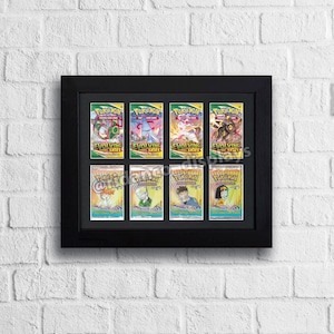 May include: A black frame with eight Pokemon cards inside. The cards are from the "Evolving Skies" set and feature various Pokemon characters.
