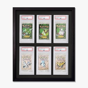 May include: Six Pokemon trading cards are displayed in a black frame with a white mat. The cards are encased in plastic sleeves and feature various Pokemon characters, including Bulbasaur, Charmander, Squirtle, and Pikachu.