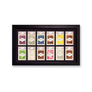 Puede incluir: Un marco negro con 12 tarjetas coloridas en su interior. Cada tarjeta tiene un patrón diferente y el texto "RIDANCO DISPLAYS" impreso en ella.