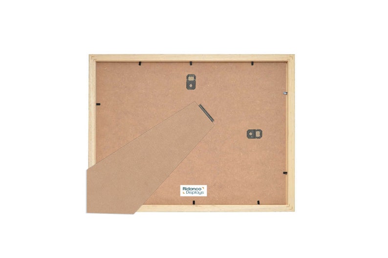 May include: The back of a light wood picture frame with a brown cardboard backing. The frame has a built-in easel stand and a label that reads "Ribbaco&reg; Displays".