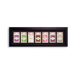 May include: A black framed display case holding seven trading card holders. Each holder contains a card with a unique design and the text "REDANCO DISPLAYS". The cards have various colors, including pink, green, and brown.