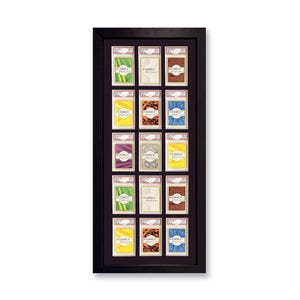 Puede incluir: Un marco negro con 15 tarjetas coloridas en su interior. Cada tarjeta tiene un dise&ntilde;o diferente y el texto "REDANCO DISPLAYS".
