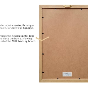 May include: The back of a light wood picture frame with a sawtooth hanger and metal tabs for easy removal of the MDF backing board. The frame is labeled "Ribanco Framing".