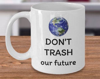 May include: White ceramic mug with a blue and green image of the Earth and the text "DON'T TRASH our future".