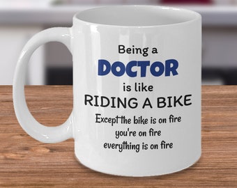 Doctor of medicine coffee mug - Being a doctor is like riding a bike - funny medical profession birthday gift - gift for resident ER doctor