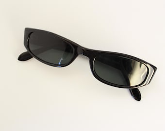 May include: Black rectangular sunglasses with dark lenses.
