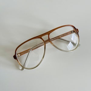 thumbnail interactive-video image 1 of Newbee Retro Clear Lens Glasses – Large Square Frames For Men Women, UV400 1 of 3