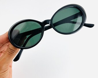 Auténticas gafas de sol ovaladas negras minimalistas vintage de los