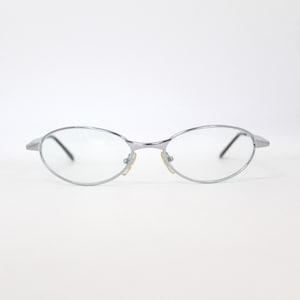 Occhiali da sole avvolgenti in metallo argentato vintage anni 2000 con lenti trasparenti