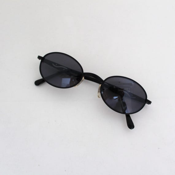 Occhiali da sole ovali nero oro con protezione laterale della linea Tropical donna uomo sport fashion fashion - Italia Occhiali da sole ovali nero oro con protezione laterale della linea Tropical donna uomo sport fashion fashion - Italia