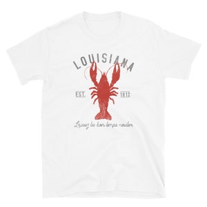 May include: White t-shirt with a red crawfish and the text "LOUISIANA EST. 1812 Laissez les bon temps rouler" printed on the front.