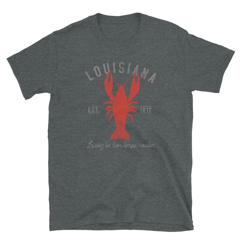 May include: A dark gray t-shirt with a red crawfish illustration and the text "Louisiana Est. 1812 Laissez les bon temps rouler".