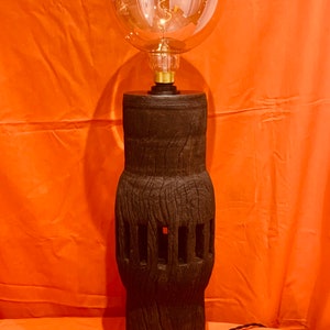 A Vintage Cart Wheel Axle Hub, recycled into a striking Table / Side Lamp. Great Christmas gift