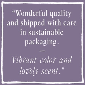 May include: A square purple graphic featuring white text that reads: "Wonderful quality and shipped with care in sustainable packaging. &mdash; Vibrant color and lovely scent." The text is enclosed within a hand-drawn white border frame.