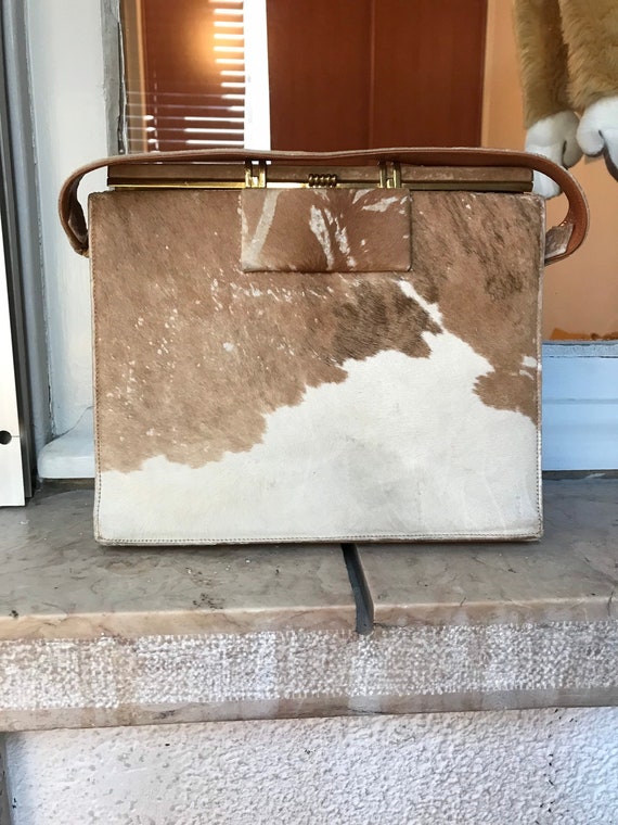 Hyper Bag Spa Sarawak - HBSS, the leaders in Vachetta leather services.  Pictured is a Louis Vuitton Alma with cowhide that was badly darkened and  rough to touch throughout, with staining and