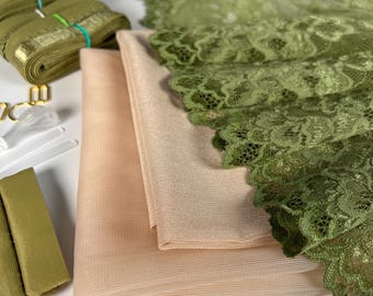 May include: A set of fabric supplies for crafting, including two pieces of sheer fabric in beige and green, a green lace trim, and green ribbon.