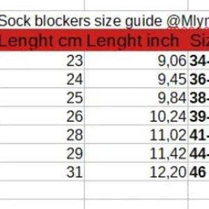 May include: Sock blocker size guide with measurements in centimetres and inches, European and US sizes.  The chart shows sizes XS through XXL with corresponding length measurements.
