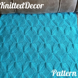 May include: A teal blue knitted blanket with a diamond pattern. The blanket is on a brown couch. The text "Knitted Decor" and "Pattern" are visible in the image.
