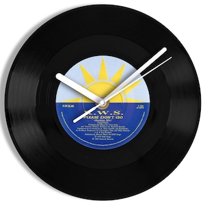 May include: A black vinyl record clock featuring a vintage record label with the text "K.W.S. PLEASE DON'T GO" and the song title "Sunshine Mary".