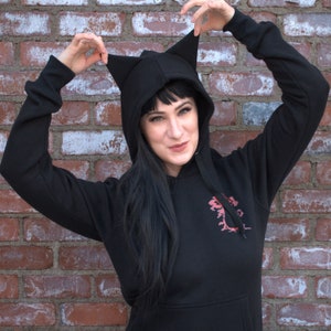 Nevernight Cat Ohr Hoodie. Mia Corvere , Mister Kindly, jay kristoff, Godsgrave, darkdawn, Buchliebhaber Geschenk, Buchtok, Büchertagramm, Humor