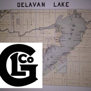May include: A black and white vintage map of Delavan Lake, Wisconsin, with the text "DELAVAN LAKE" at the top. A black and white logo with the letters "LG" and "Co" is in the lower left corner.
