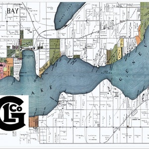 May include: A vintage map of Lake Geneva and Williams Bay, Wisconsin, with detailed land divisions and street names. The map features a blue lake and surrounding areas in various colors. A black and white logo is in the lower left corner.