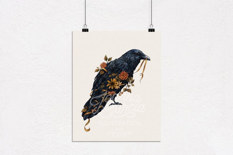 May include: A black raven with a gold ribbon in its beak, surrounded by orange, yellow, and brown flowers. The raven is perched on a branch with its wings spread out. The background is a light cream color. The image is titled "Joy Felicia Illustration & Design".