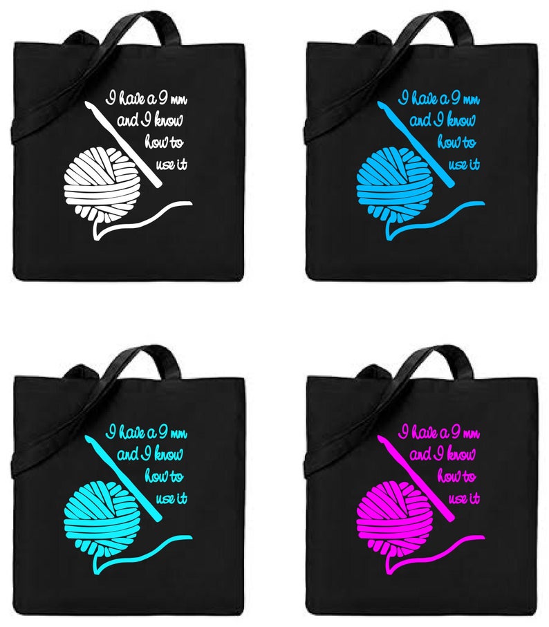 May include: Four black tote bags with white handles. Each bag features a different coloured yarn ball and crochet hook with the text "I have a 9 mm and I know how to use it".