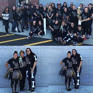May include: A group of people dressed in black shirts with a skeleton graphic and the text "I got this feeling inside my bones". Some people are wearing skeleton costumes and accessories. The group is standing in front of a brick wall.