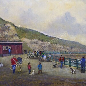 May include: An oil painting depicts a coastal scene with people walking dogs. A red building with a window and a small group of people are on the left. A green fence runs along the right, with a hill in the background.