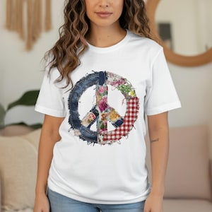 White t-shirt with a distressed peace sign graphic made of denim and floral fabric.