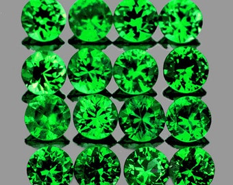 May include: A collection of 15 round, faceted green gemstones. The gemstones are arranged in a grid pattern.