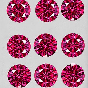 May include: Nine round, faceted, pink gemstones arranged in a grid pattern. The gemstones are set against a white background.