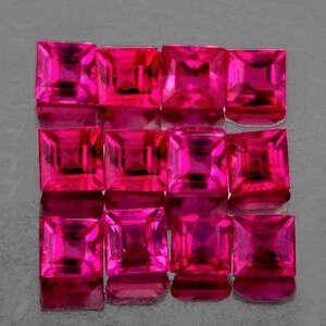 May include: A collection of square-cut, vibrant pink gemstones arranged in a grid pattern. The gems have a high degree of clarity and reflect light, showcasing their facets. The overall presentation suggests a collection of precious stones.