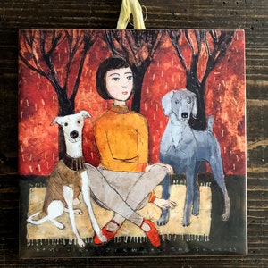 May include: A painting of a woman with two dogs. The woman is wearing a yellow sweater and red shoes. The dogs are a greyhound and a grey dog. The background is a forest scene with red and orange leaves.