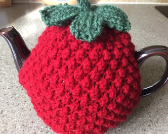 Hand knitted strawberry tea cosy