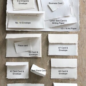 May include: A variety of white card and envelope sizes, including 5x5, 7x7, A1, A2, A6, A7, A9, and No. 10. The cards and envelopes are made of textured paper and have a rustic, handmade look.