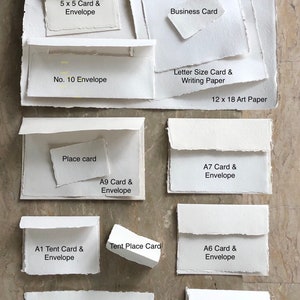 May include: A variety of white card and envelope sizes, including 5x5, 7x7, A1, A2, A6, A7, A9, and No. 10. The cards and envelopes are made of textured paper and have a rustic, handmade look.