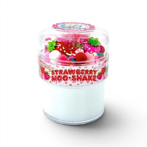 May include: A clear plastic container filled with white slime, topped with decorative strawberries, pink pom-poms, and candy. The container has a pink and white label that reads "Strawberry Moo Shake."