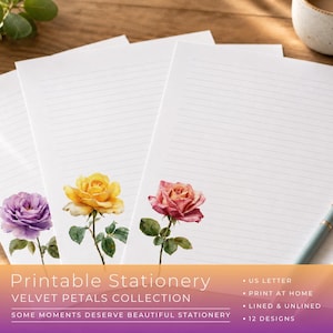 May include: Three sheets of white lined stationery paper, each featuring a single watercolor rose illustration at the bottom. The roses are purple, yellow, and pink. Two pens are placed on the right side of the paper sheets.
