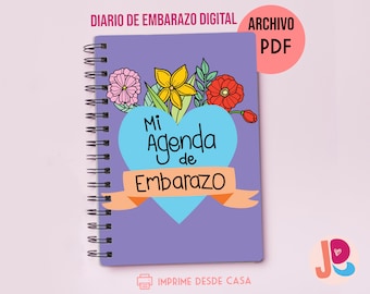 May include: A purple printable pregnancy journal with a blue heart and the text "Mi Agenda de Embarazo". The journal cover features a floral design with pink, yellow, and red flowers. The text "IMPRIME DESDE CASA" is at the bottom of the cover.