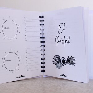May include: An open notebook with white pages and a black spiral binding. The left page features two geometric diagrams with numbered sides and the word "NOMBRE:" The right page has the words "El Pastel" in cursive and a floral illustration.