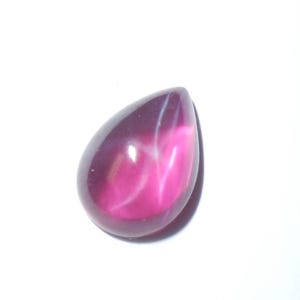 May include: A teardrop-shaped pink gemstone with a white star-like pattern inside.